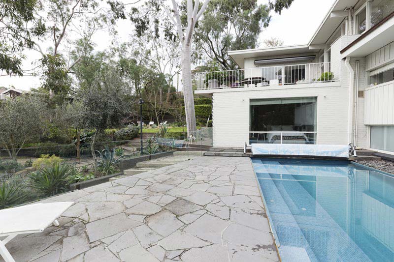 Australian home with glass pool fencing