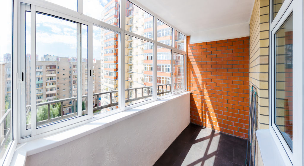 Picture of aluminium frame window with view of apartment buildings